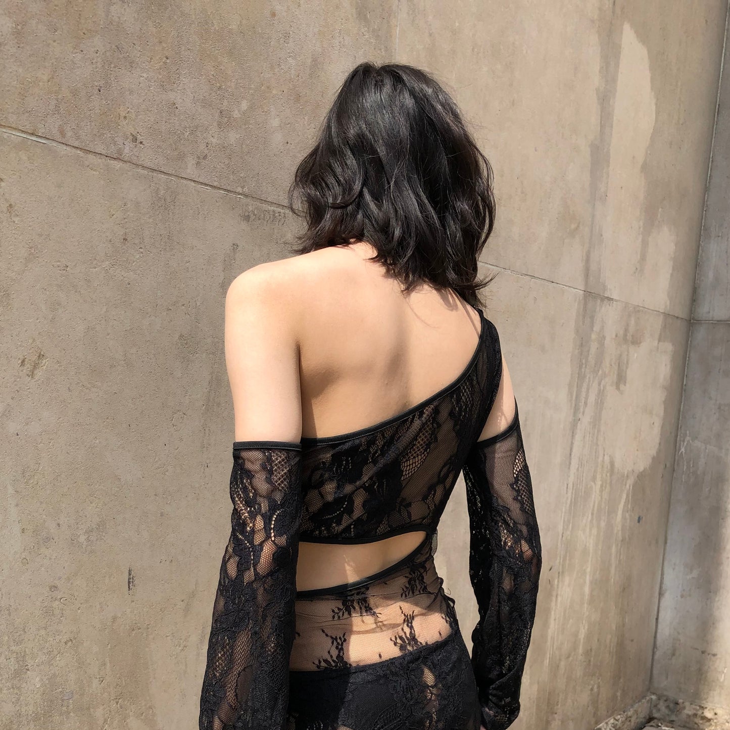 Captivating product image featuring a black lace mini dress by Eastern Underwear, an exquisite Parisian brand. This sultry mini dress showcases intricate lacework, embodying the brand's signature blend of sophistication and allure for an unforgettable lingerie experience.